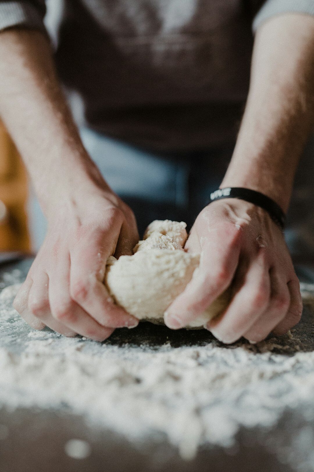 baker kneading dough