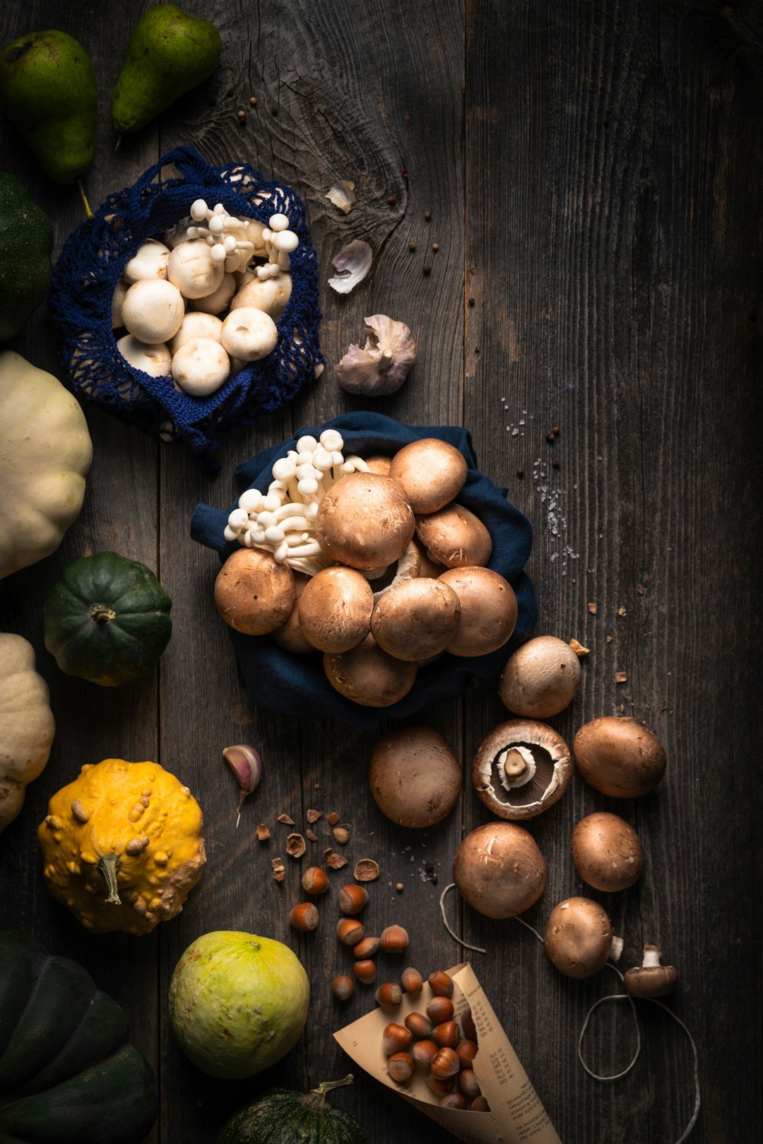 Autumn harvest of apples, plums and mushrooms